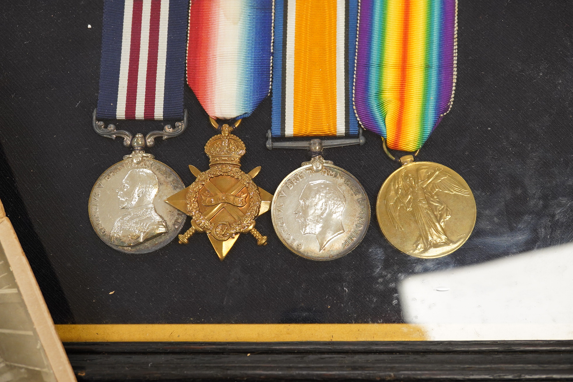 A framed First World War medal group awarded to Lance Corporal J. Austin Royal Sussex Reg. including the Military Medal for bravery, together with a separately framed certificate detailing the reason for the award; for t